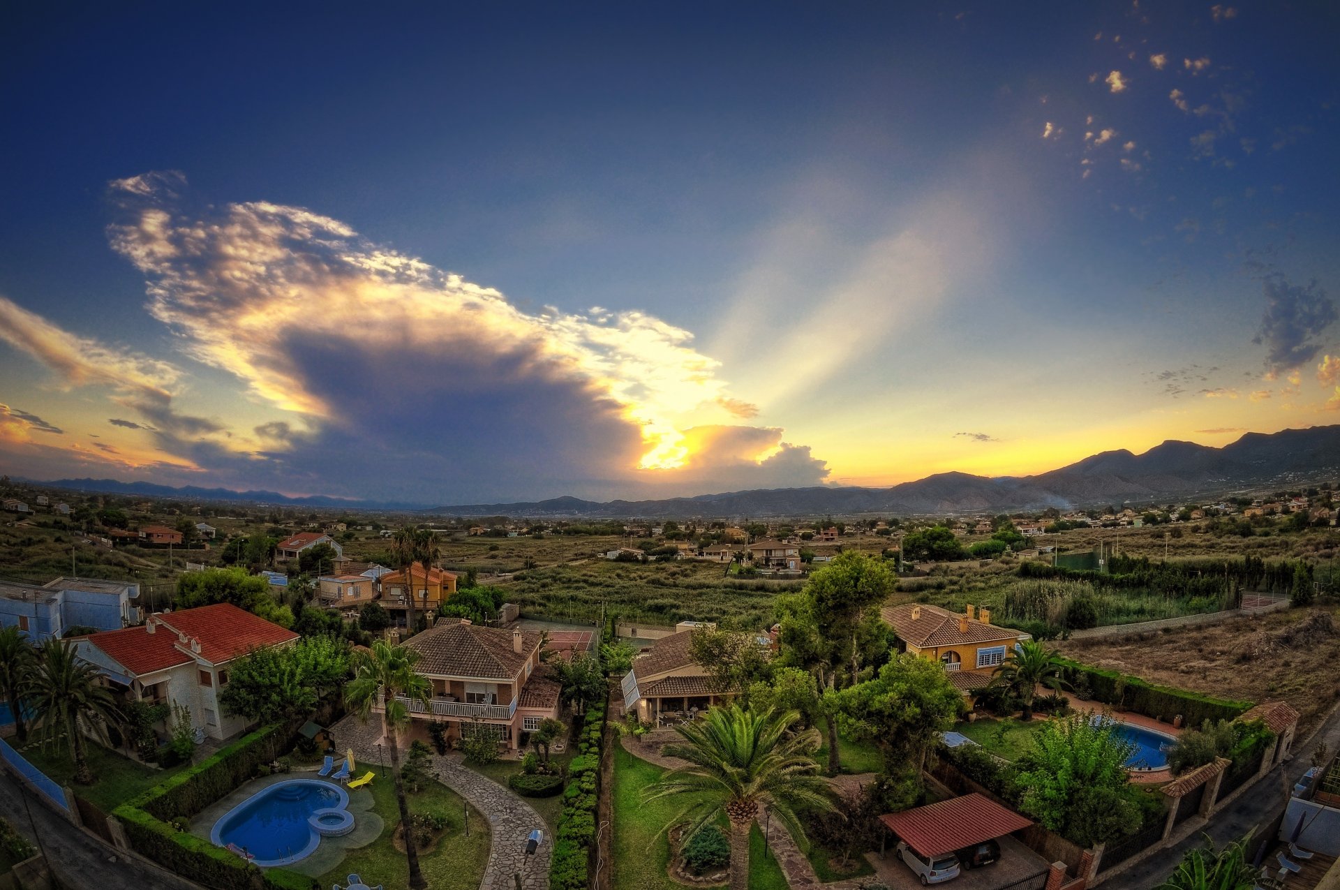 castellón spanien tal häuser pools bäume himmel wolken sonnenuntergang