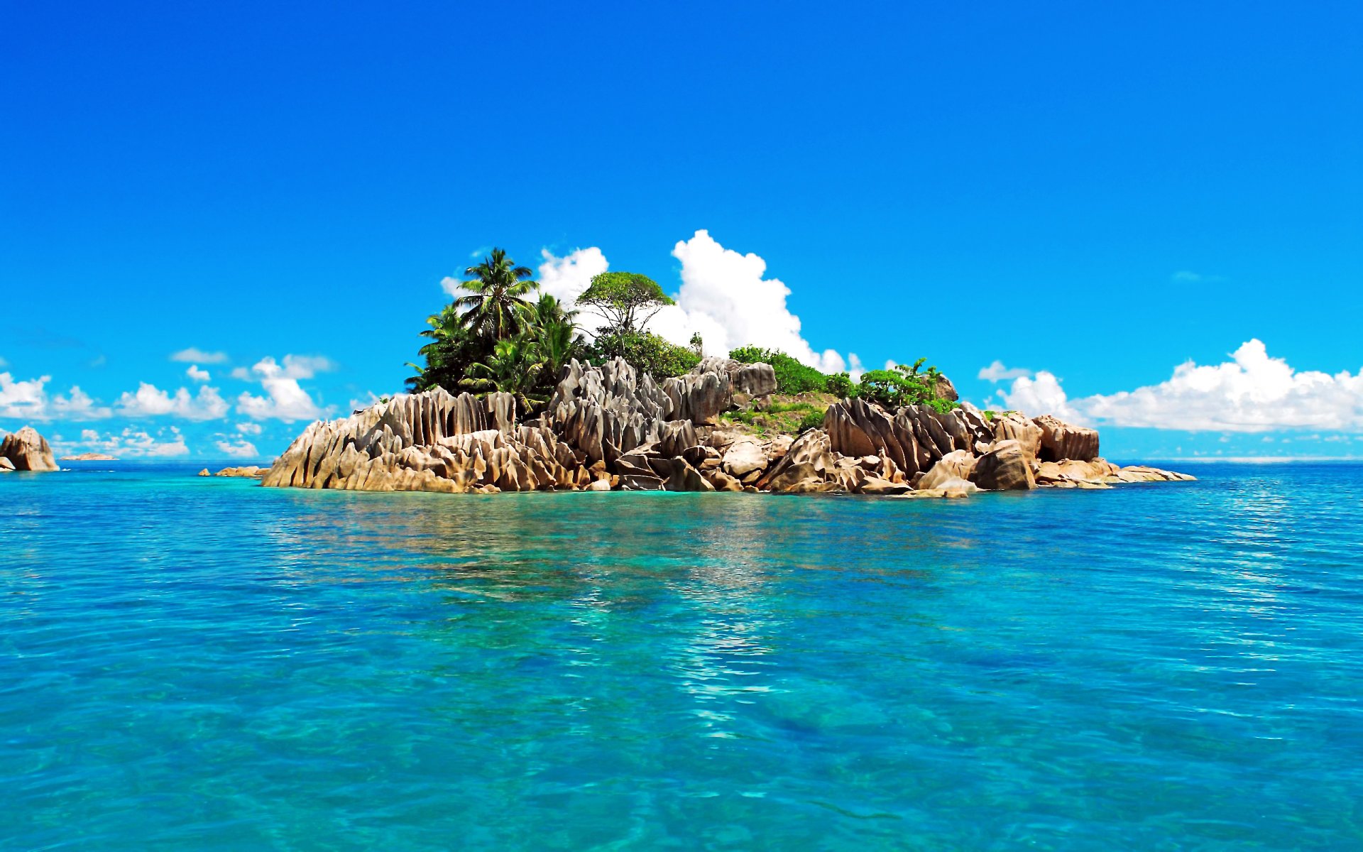 tropics seychelles sky clouds sea ocean island palm stones rock