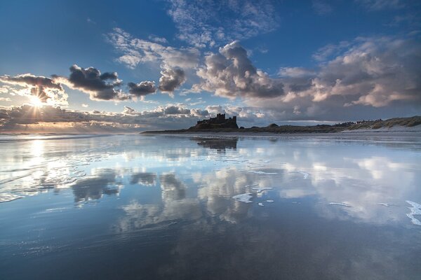 Reflection of the cloudy sky in the water