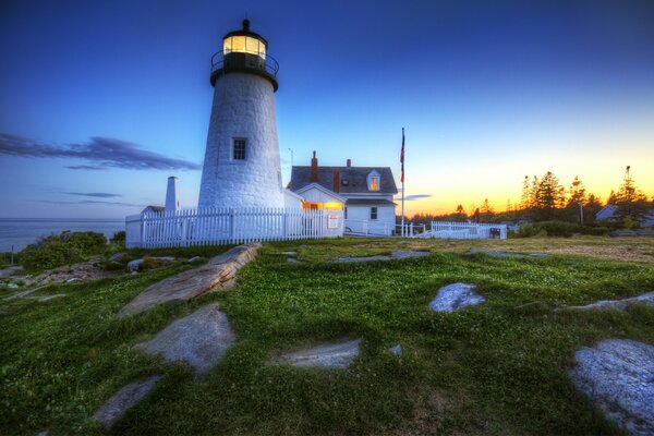 The lighthouse turns on at sunset