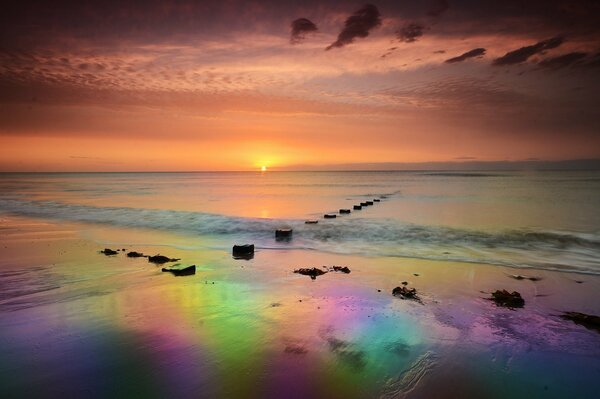 Rainbow dawn on the seashore