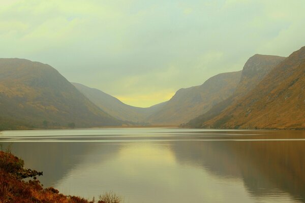 Morning landscape with lake and mountains