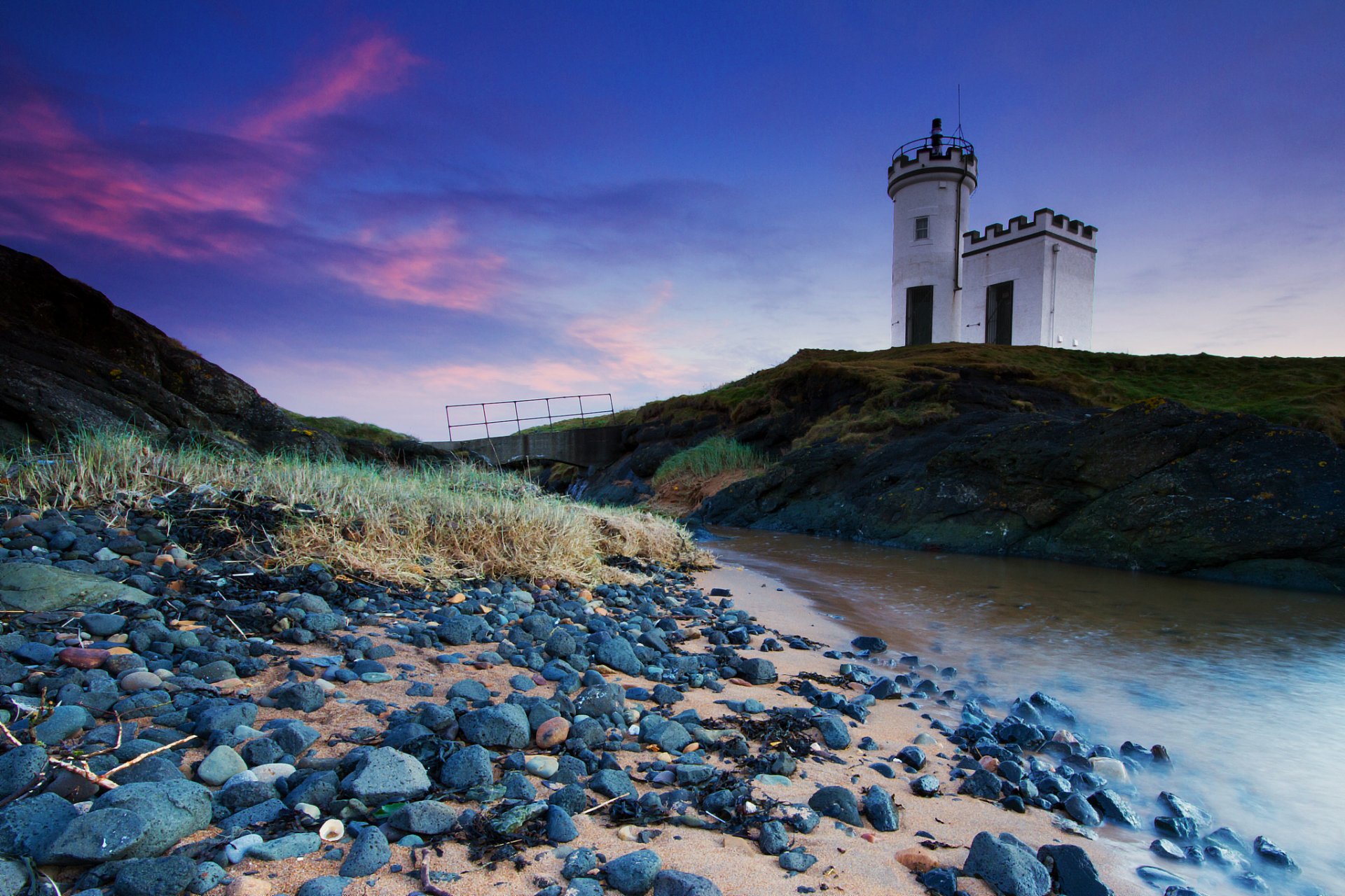 united kingdom scotland lighthouse hill creek grass stones blue sky cloud