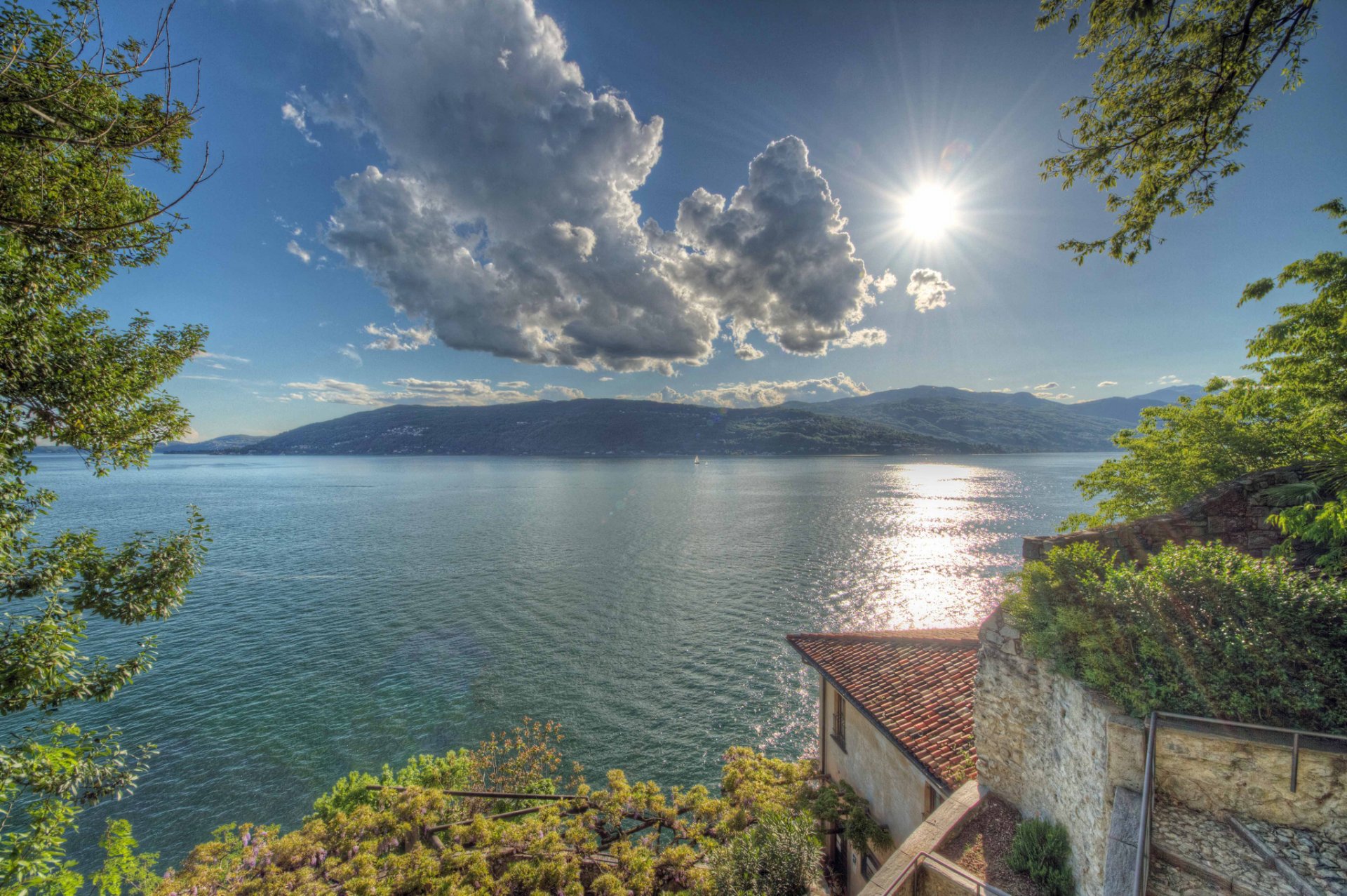 leggiuno varese lombardia italy lake maggiore lombardy lake mountain clouds water surface