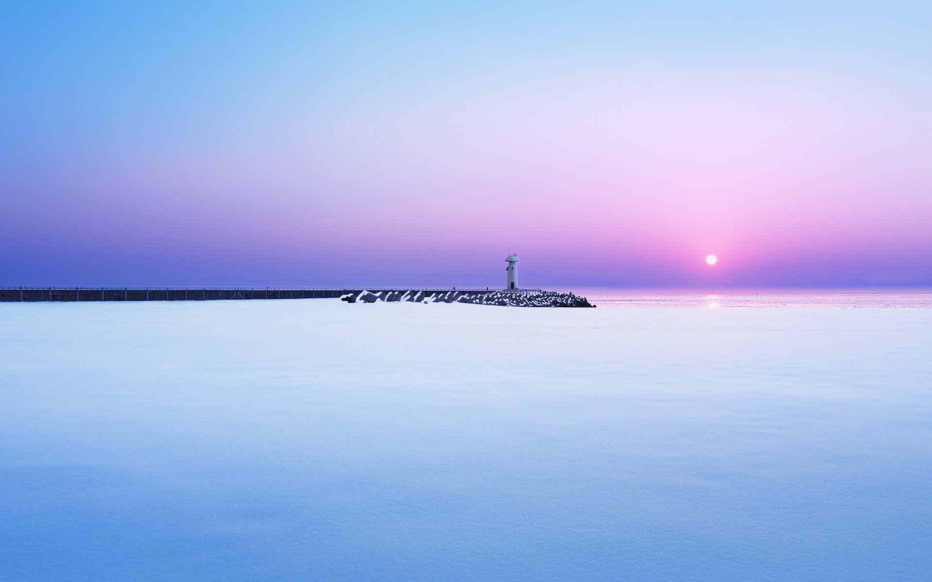 mer jetée phare neige hiver matin aube