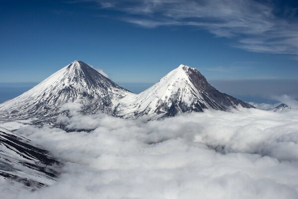 Snow-capped mountains towering above the clouds