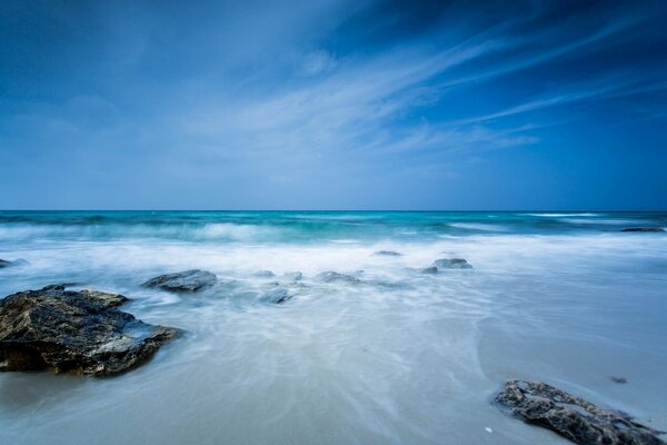 Seascape. Stones on a blue background