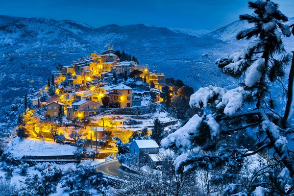 Panorama of a mountain village on a winter evening