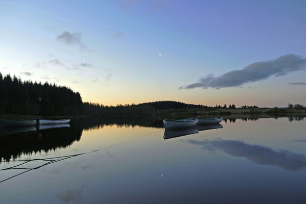 Boats on the lake before dawn