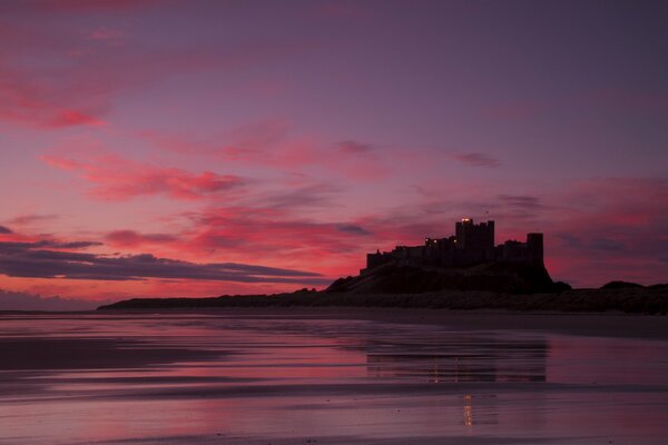 Castle on the background of a crimson sunset