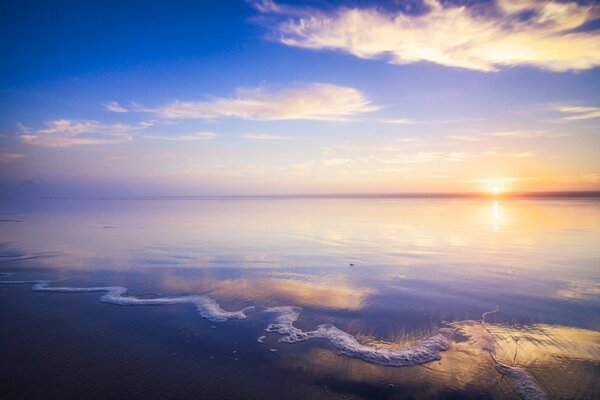 Sandy beach with the rising sun