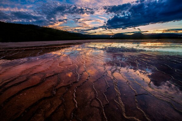 Low tide in the evening against the background of hills