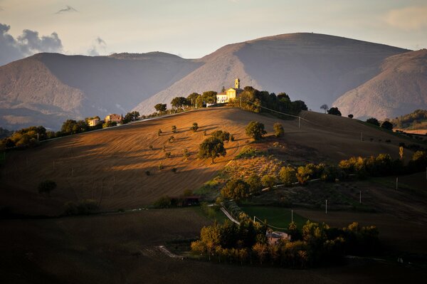 A house on a hill flooded with light