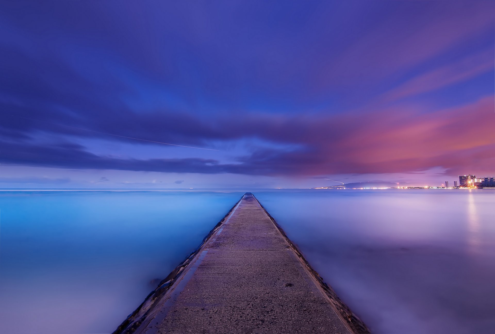 usa hawaii ocean coast coast calm night blue lilac sky clouds far away city light