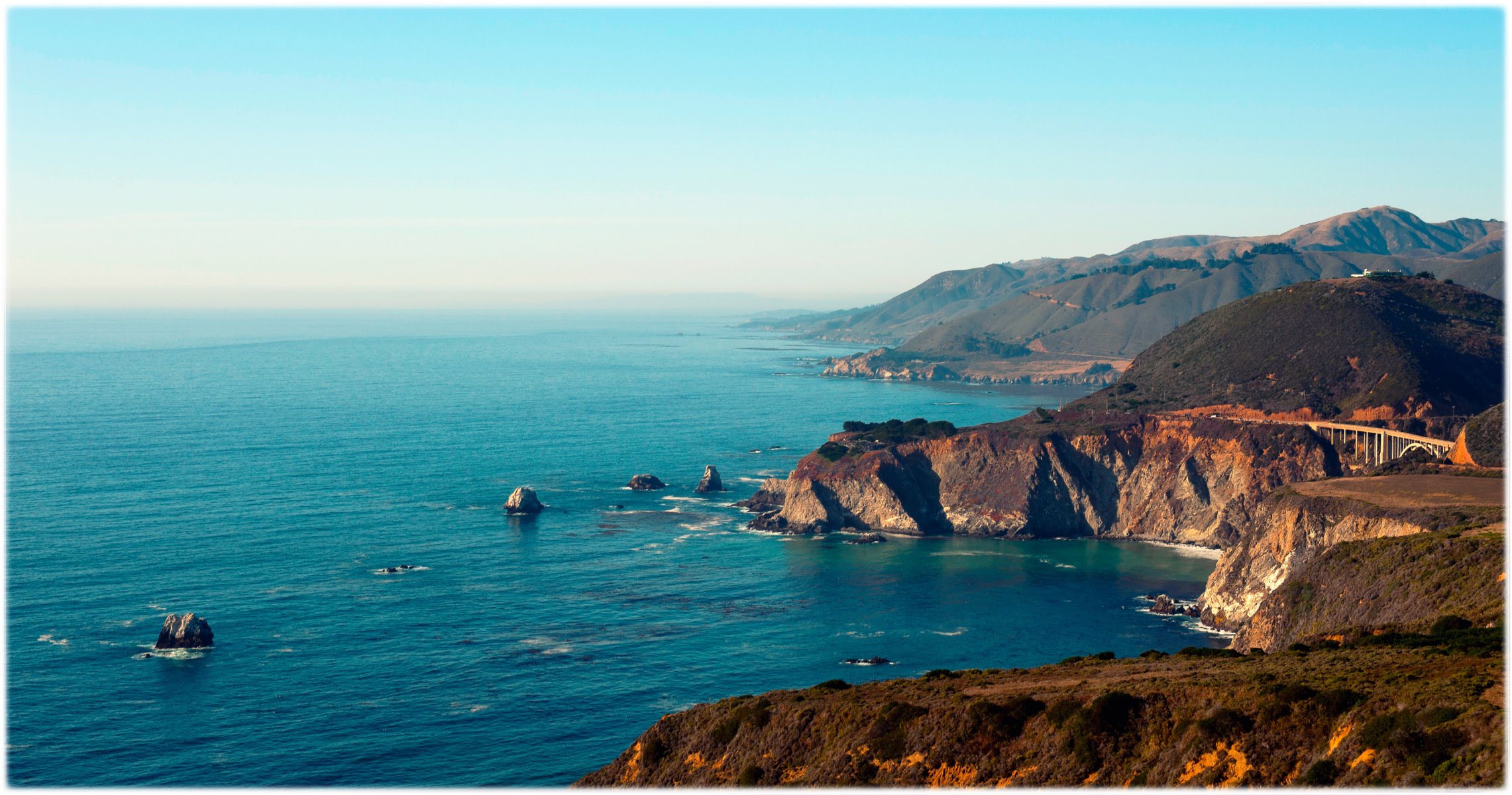 big sur california costa del pacifico baie scogliere ponte bixby colline foreste di conifere paesaggio mozzafiato