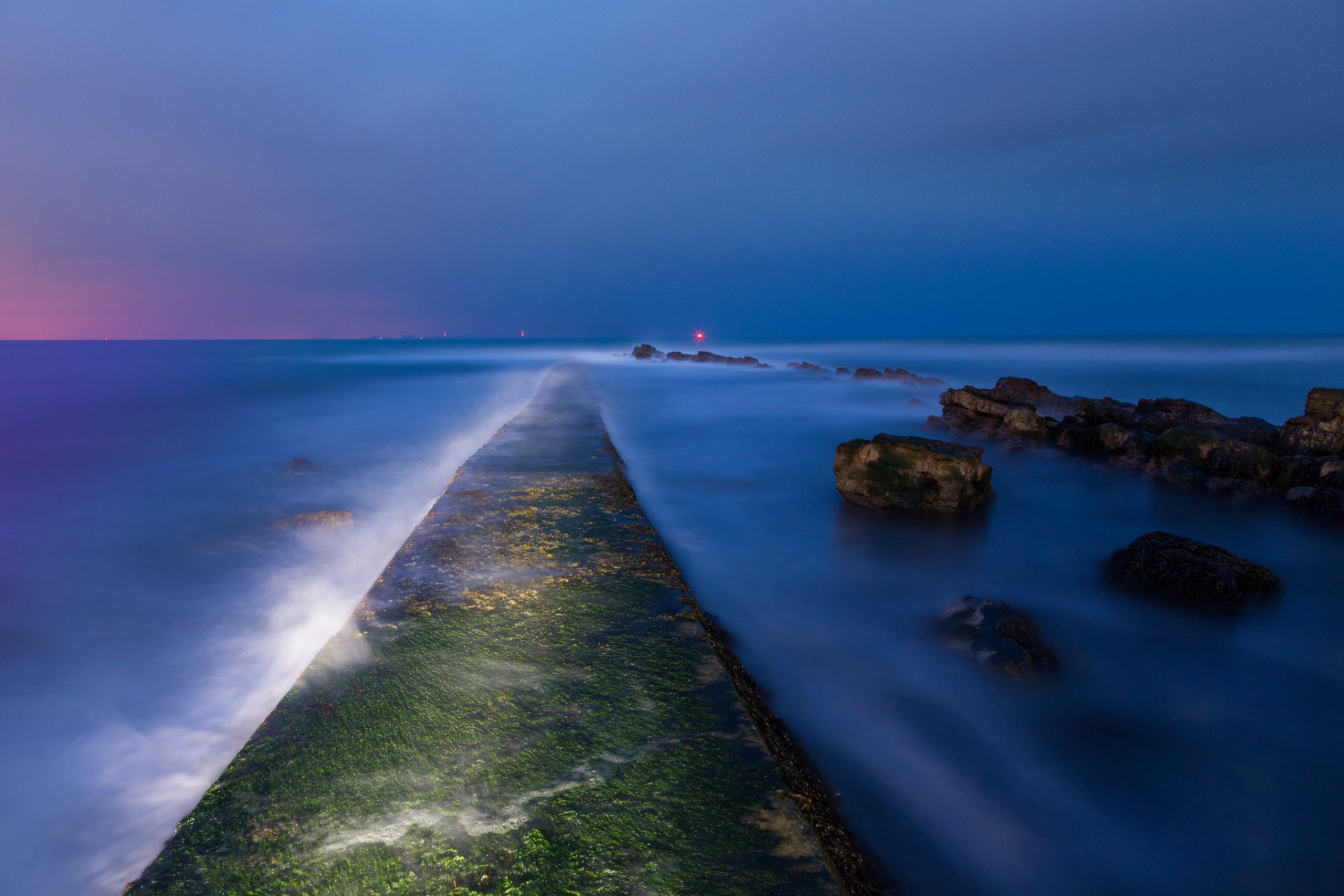 united kingdom england night twilight gulf sea beach stones moss lights away sky blue