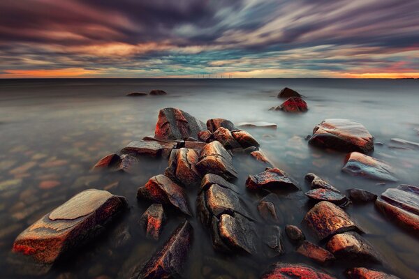 Rocks in the sea at sunset in Sweden