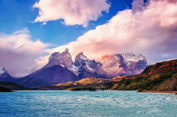 Pink clouds over the sea and mountains