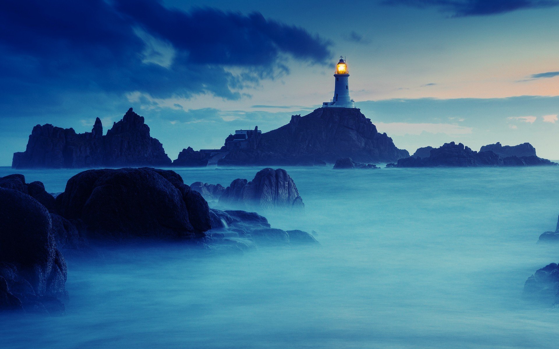 lighthouse ocean rock stones nature