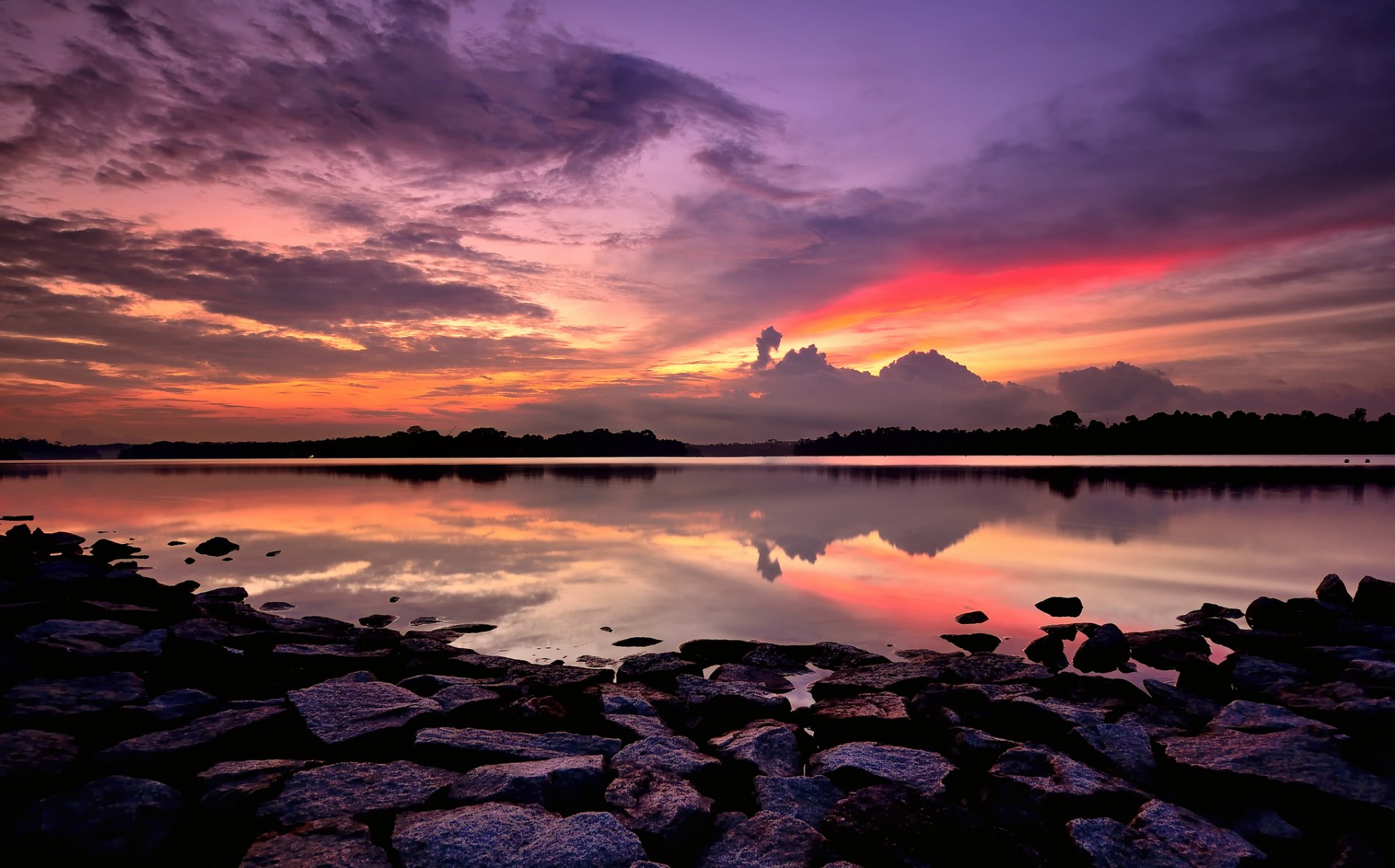 singapore baia costa pietre sera arancione luminoso tramonto lilla cielo nuvole