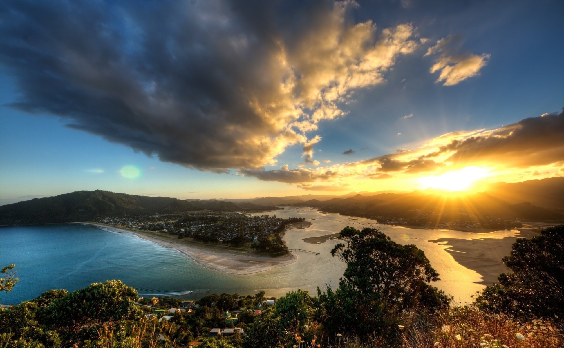 un sunset water sky mountain clouds nature landscape