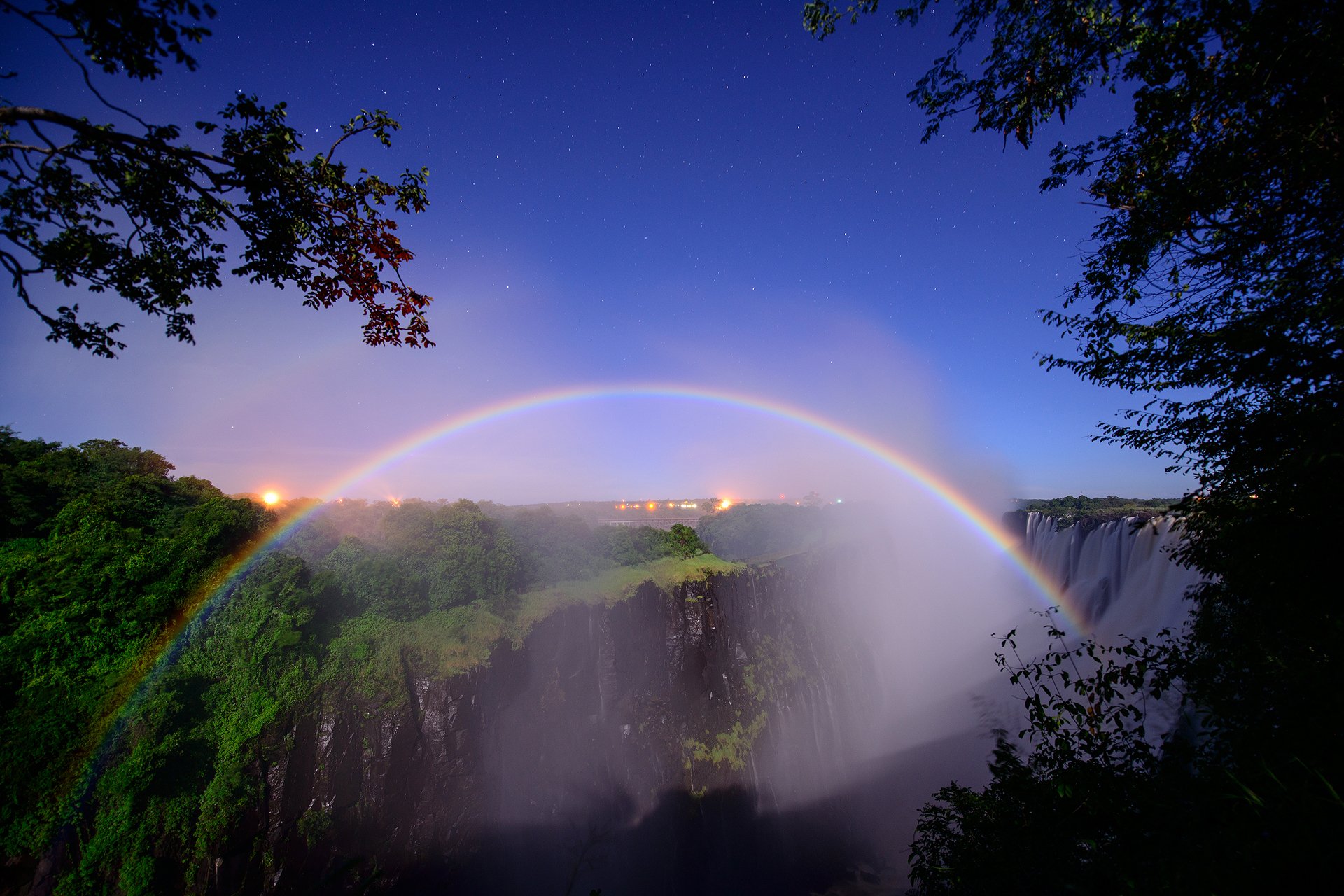 outh africa border of zambia and zimbabwe river zambezi waterfall victoria lunar rainbow night star tree peter dolkens photography