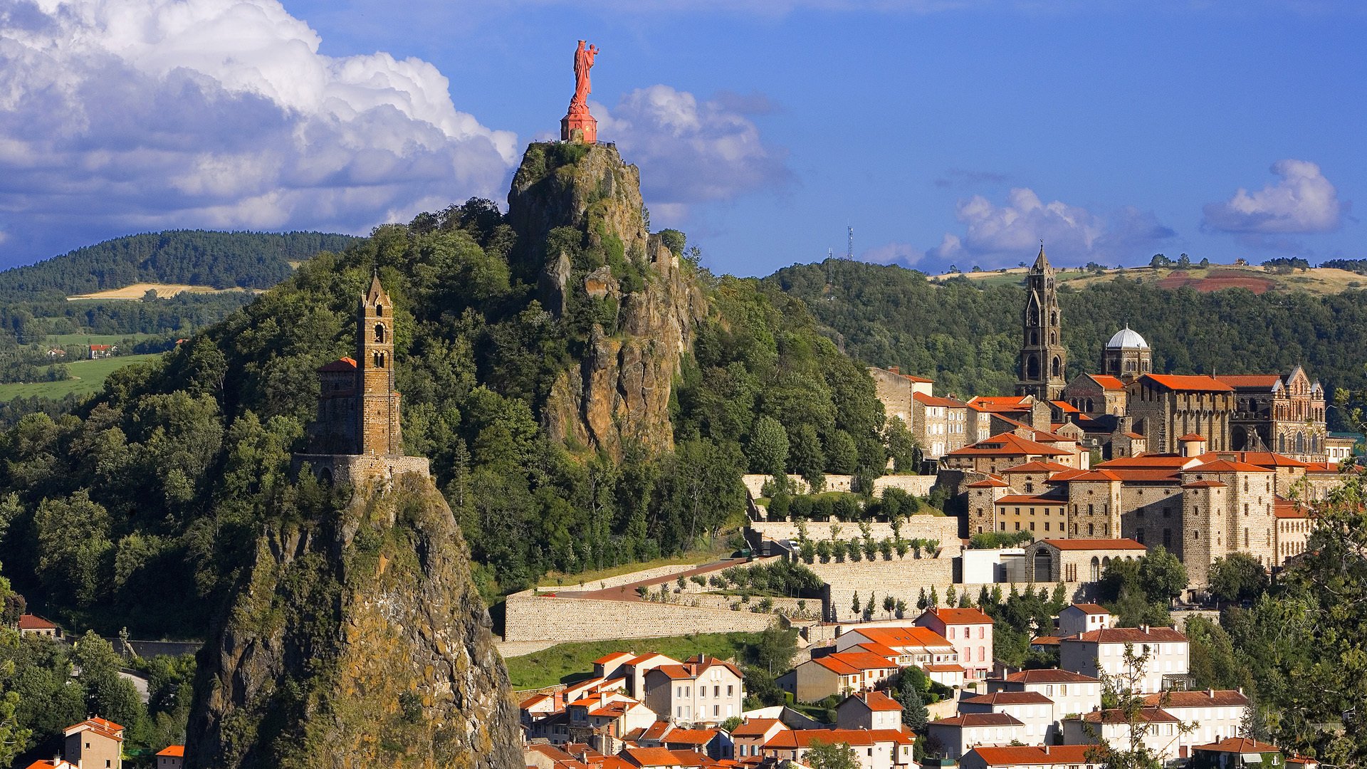 le puy-en-velay france mountain statue buildings town