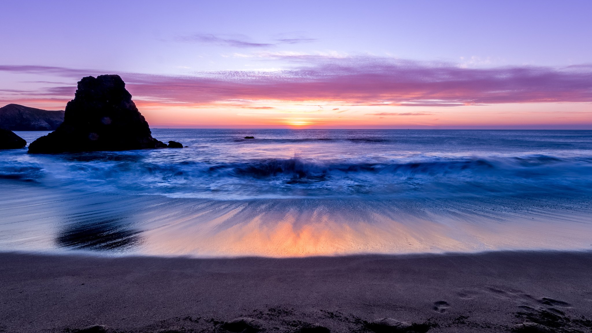 ea ocean waves sand beach rock horizon night sunset lilac sky cloud