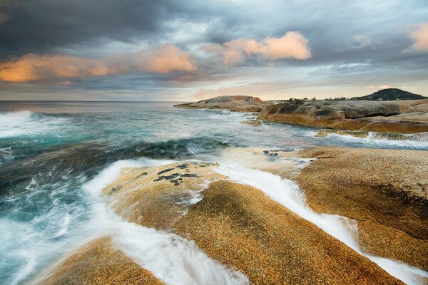 Ocean waves crashing against rocks