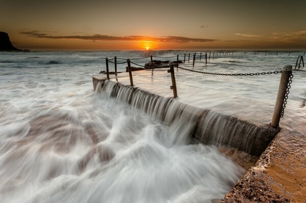 A seething stream of water on the pier