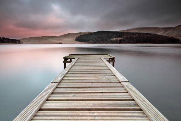 The bridge over the lake and the evening sky