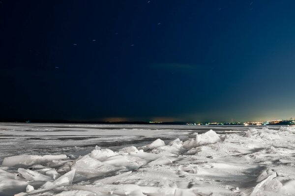 The Big dipper in the sky over the icy Volga in Samara