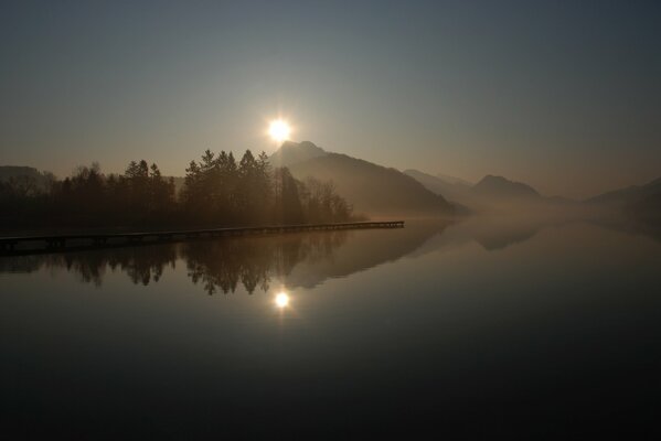 Sunrise came out from behind the mountains morning fog