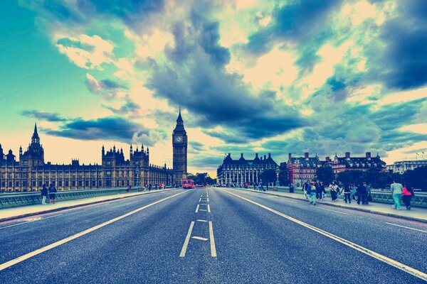 A picture from London with big ben with people