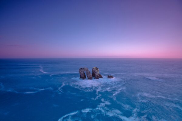 The sea is beating against rocks and rocks