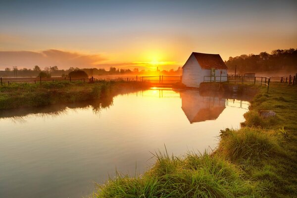 Evening landscape of the village lake