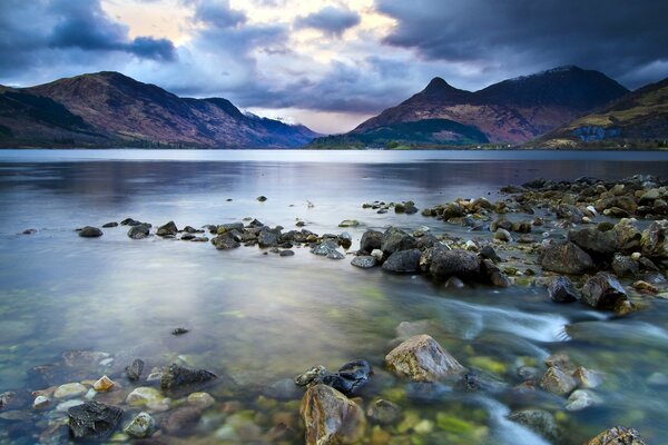 Clear water of the lake with stones