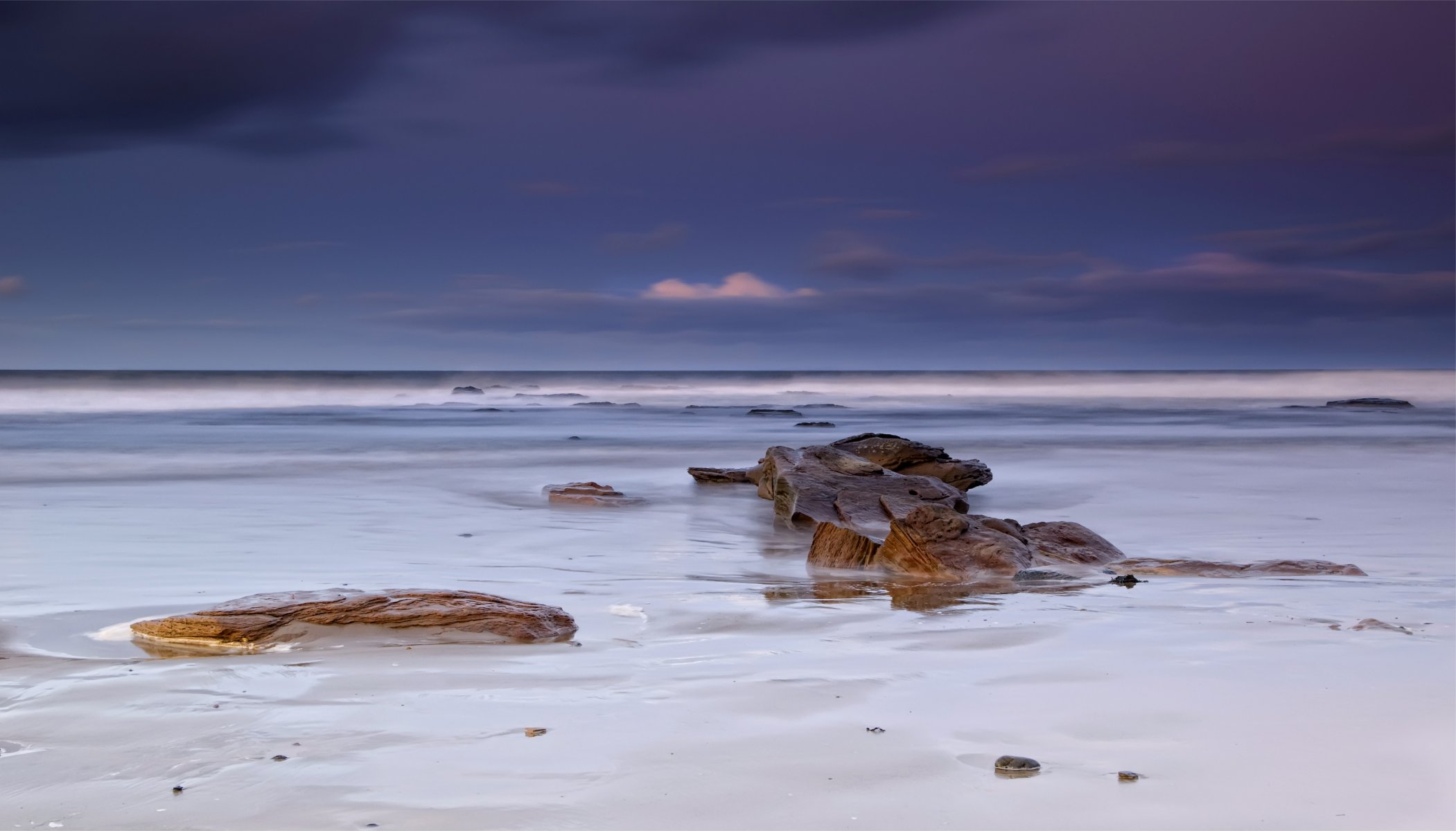 great britain england sea beach white sand shore rocks evening blue lilac sky clouds cloud