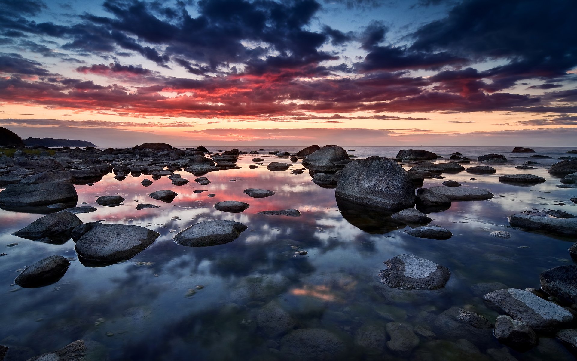 puesta de sol cielo nubes reflexión mar piedras alemania