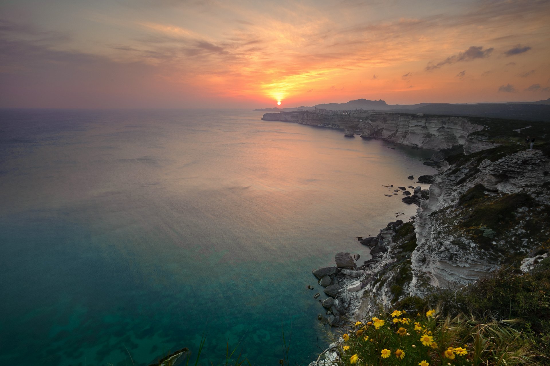 ea ocean water horizon beach rock sun sunset sky night nature