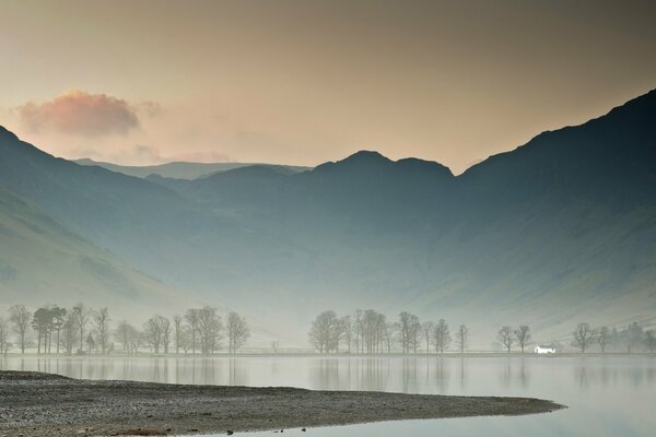 Spring is coming on a lake surrounded by mountains