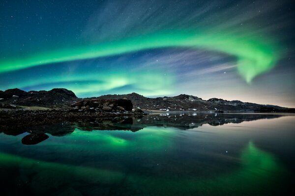 Northern lights in the reflection of the sea