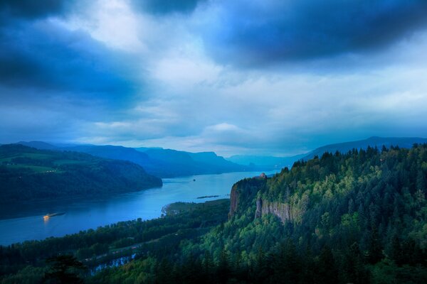 The river between the mountains in the evening