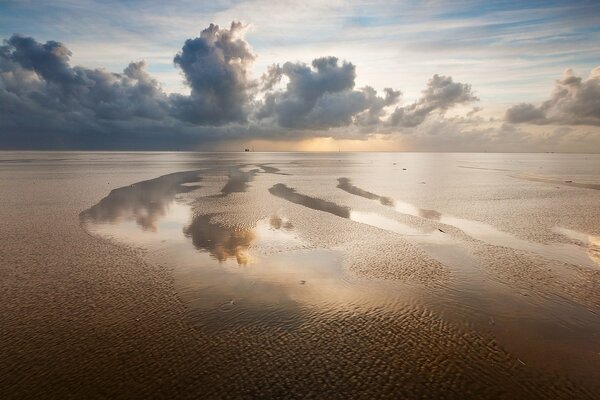 Raging Clouds on the background of a serene beach