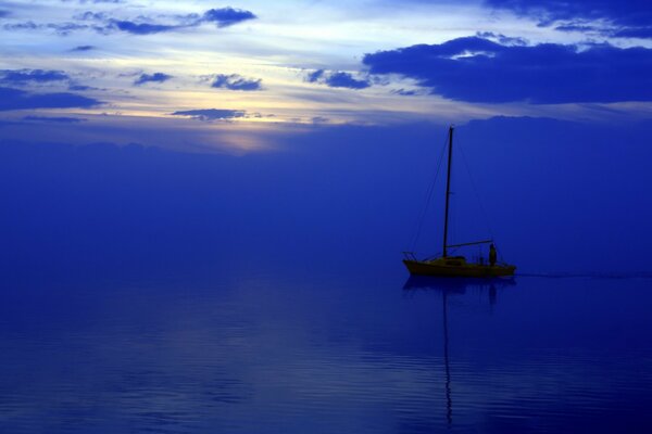 Landscape boat at sea at night