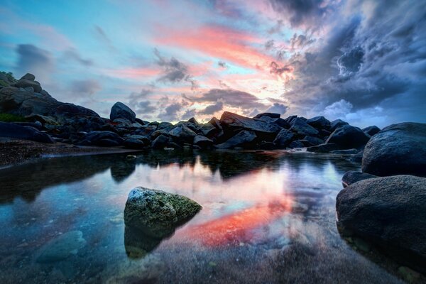 Night landscape stones in the sea