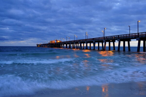 Blue clouds over the evening sky of the pier