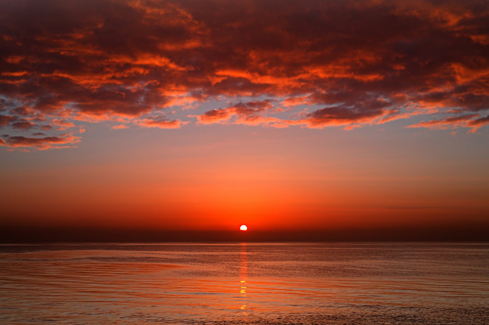 unset bloody red sun sea