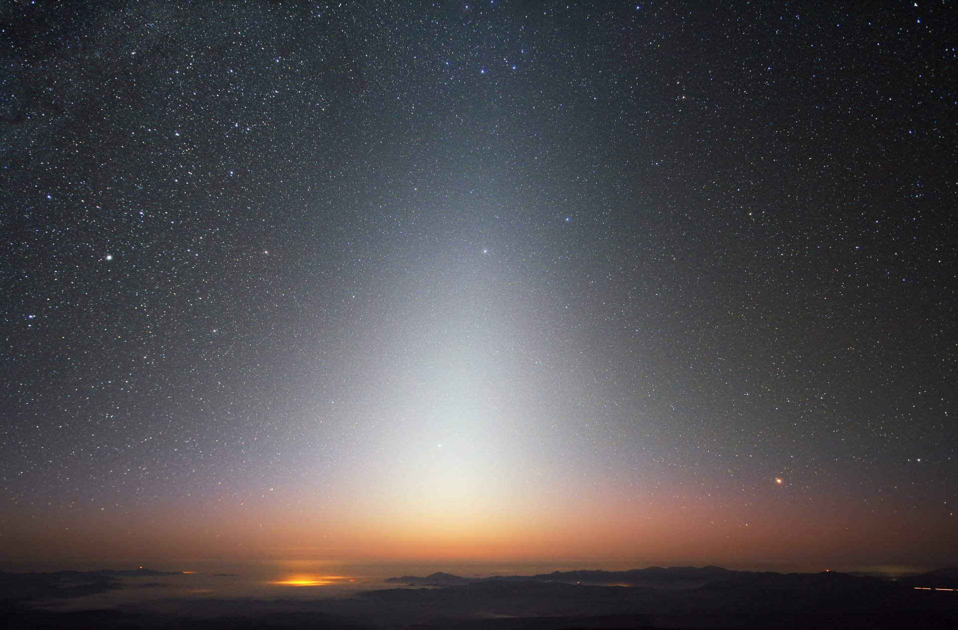 zodiac light sky star town lights mountain fog