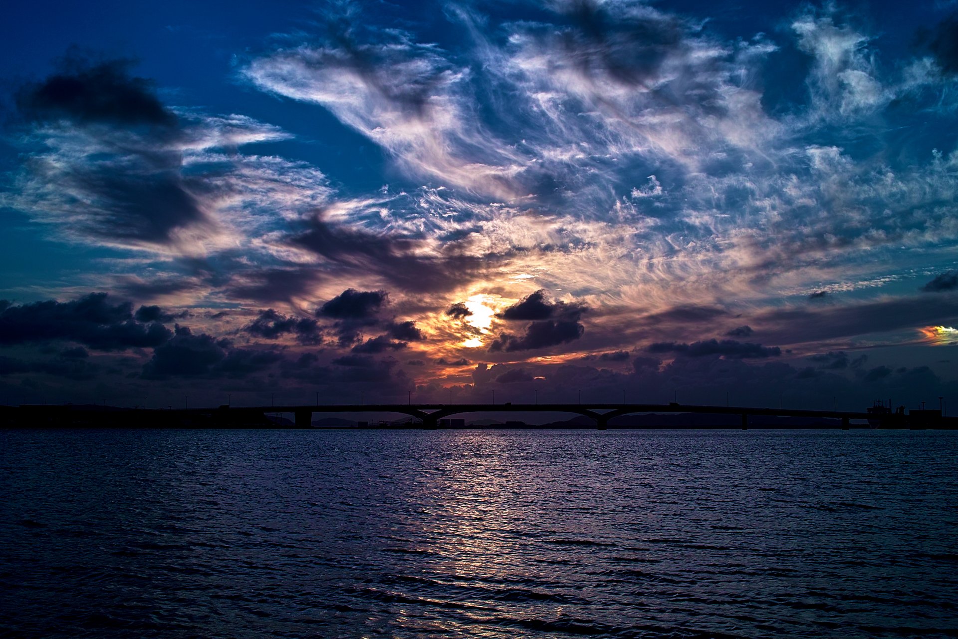 mar puente noche cielo nubes